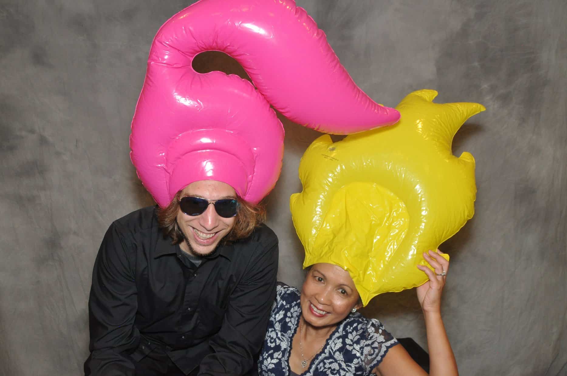 photo booth fun with pink and yellow hair props