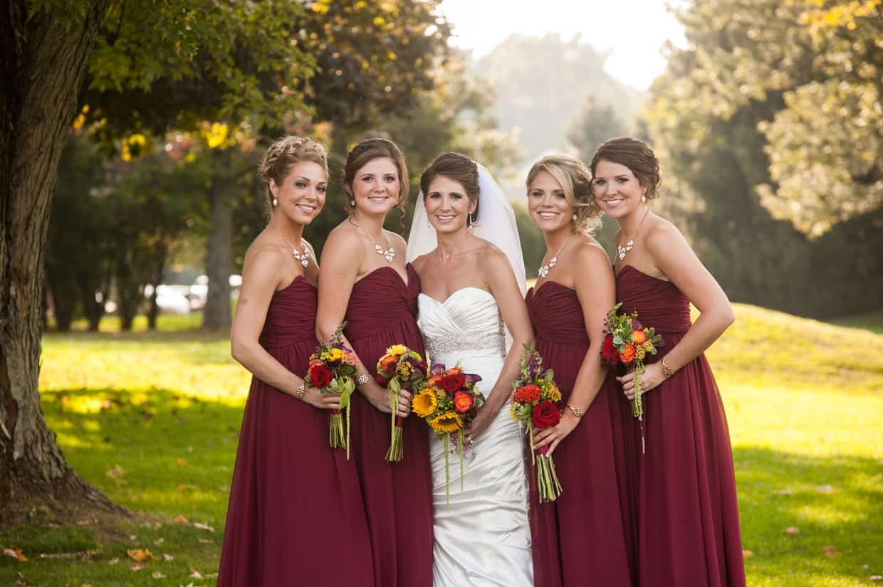 Bridesmaids holding fall bouquets at Penn Oaks Country Club