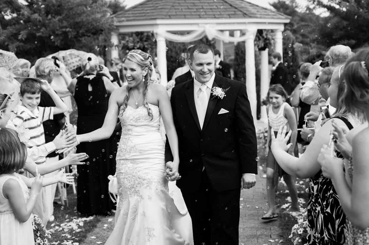 Bride and groom walking out of ceremony at Penn Oaks Country Club